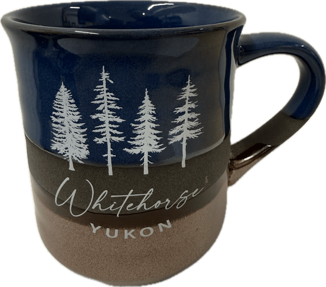 Blue mug with white tree design and 'Whitehorse Yukon' text on a clear background